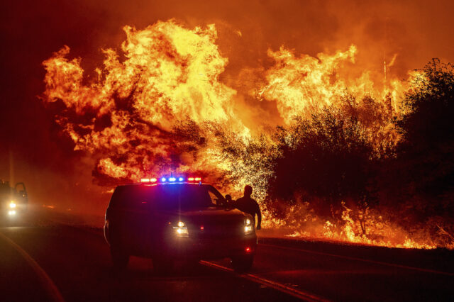 Wildfires grow bigger and strong winds, snowstorms hit Rockies