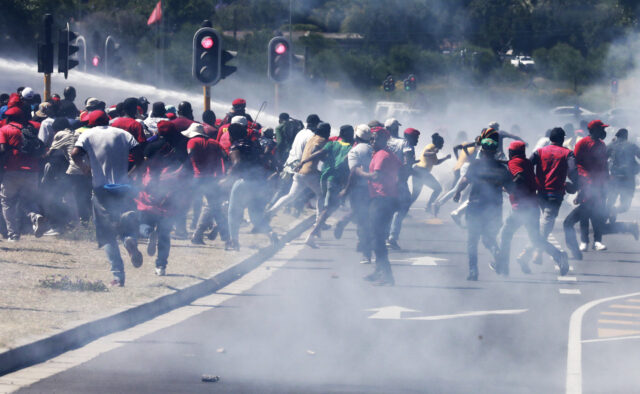 South African police use tear gas on protest over race