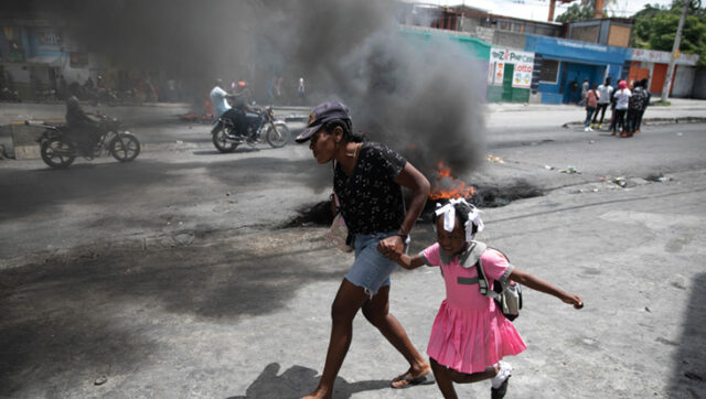 Haitians protest rising insecurity; some burn a plane