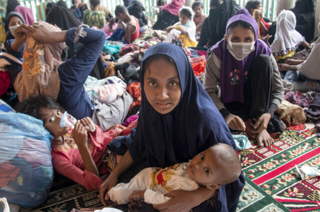 Rohingya flee Myanmar, land by boat in Indonesia