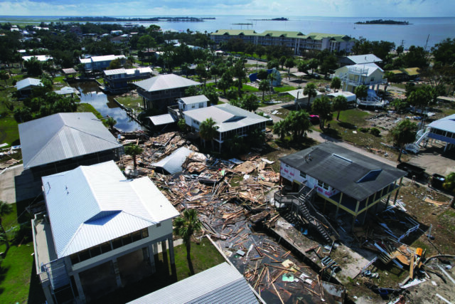 Residents pick through the rubble of lost homes and scattered belongings in Hurricane Idalia’s wake