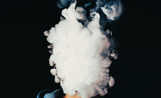 The face of vaping young man
