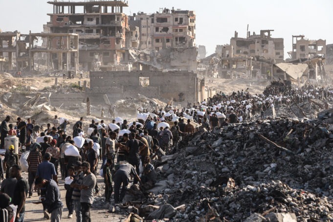 Gazans starved by Israel flock to Zikim aid distribution point for limited flour