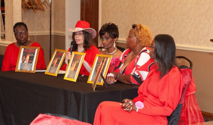 A group of women sitting at a table AI-generated content may be incorrect.