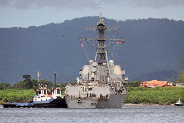 U.S. continues threats, circling Venezuela with warship in Trinidad and Tobago