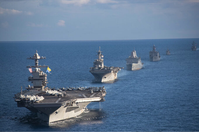 Several military ships in the ocean AI-generated content may be incorrect.