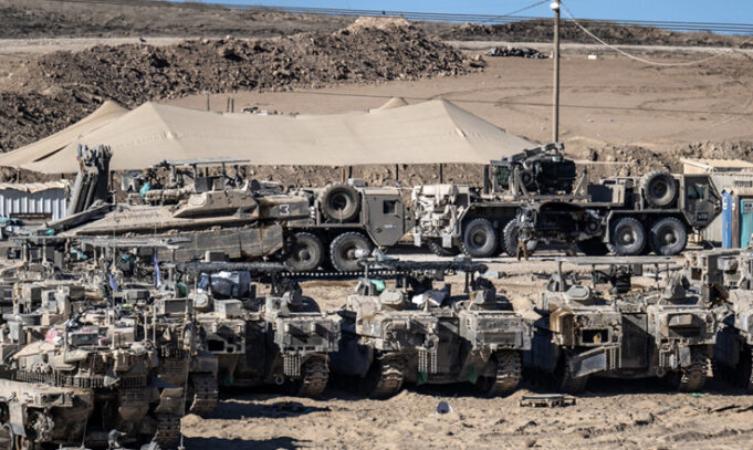 a-group-of-military-vehicles-parked-in-a-dirt-fiel A group of military vehicles parked in a dirt field AI-generated content may be incorrect.