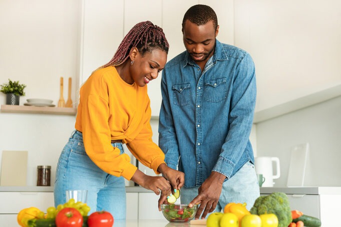 Healthy Nutrition. Young African American Couple Cooking Fresh V